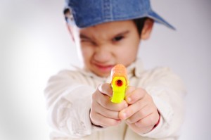 Boy with toy gun (PRNewsFoto/American Academy of Ophthalmo...)
